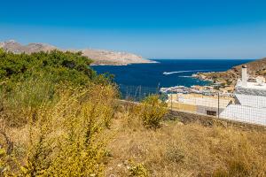 Plot with amazing view over the Agia Marina, and the Pandeli bay